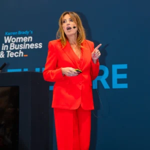 Lou Robey speaking at Karren Brady's Women in Business & Tech Expo in London on 2 Oct 2024